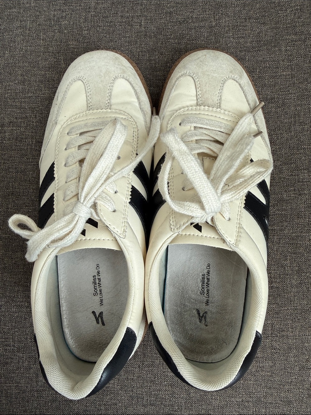 White Sneakers with Black Stripes